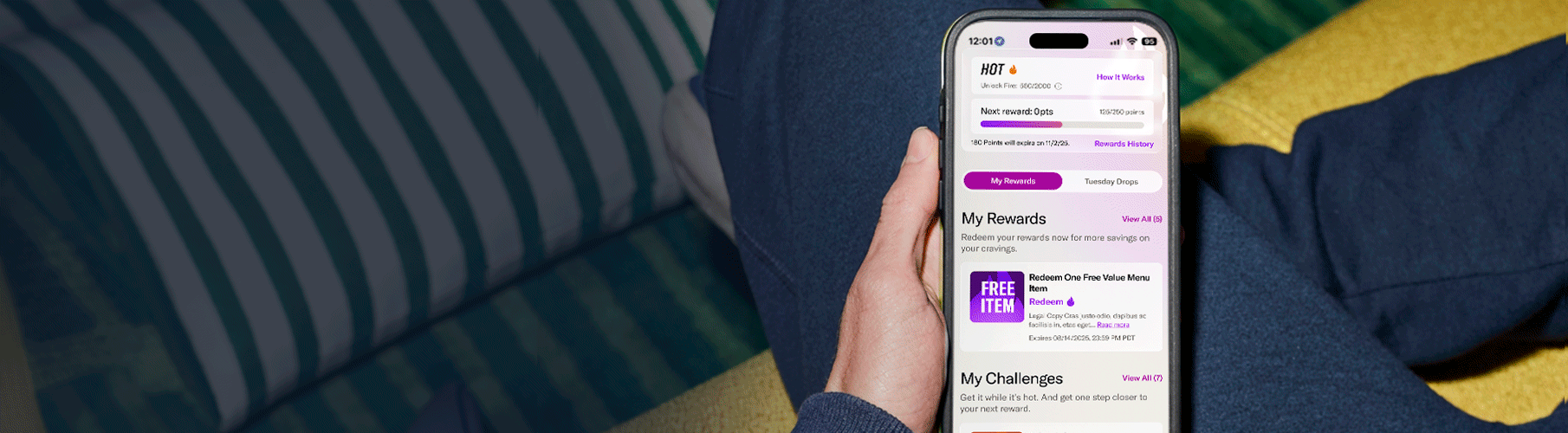 The Taco Bell app's rewards dashboard shown on a phone